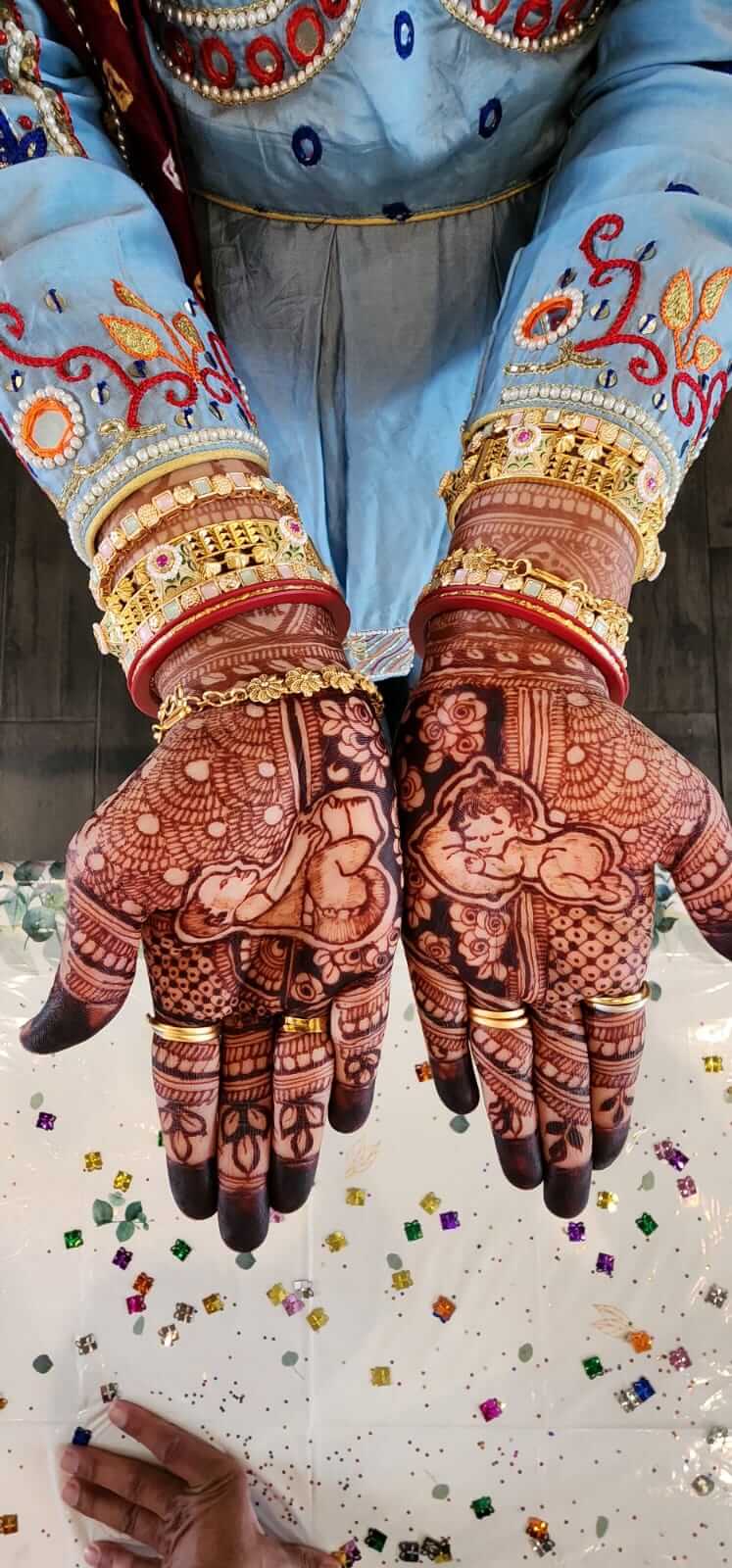 Beautiful baby shower henna design with natural henna paste by Hiral's Henna, professional mehndi artist serving Atlanta, Gainesville, and North Georgia