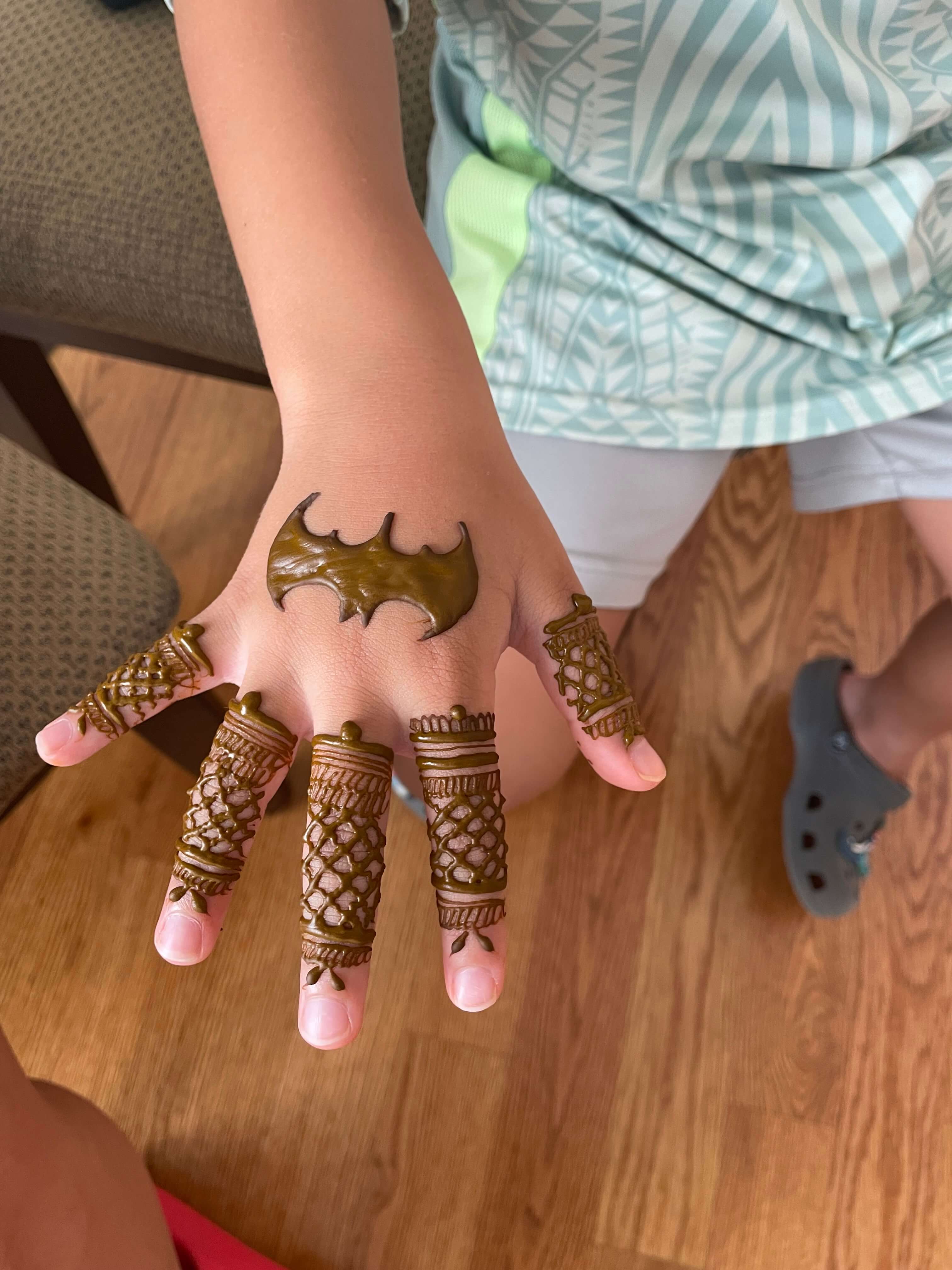 Fun henna tattoo designs for kids at a henna party by Hiral's Henna, serving birthday parties and events across Atlanta and North Georgia